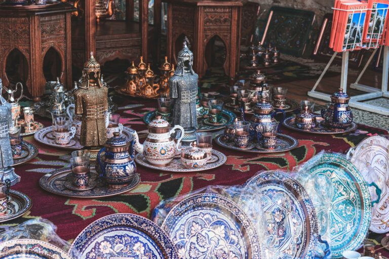 A table topped with lots of plates and vases